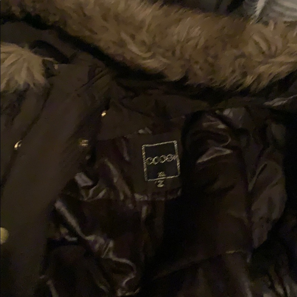 I’m selling a dark green coogi jacket wit fur hood
